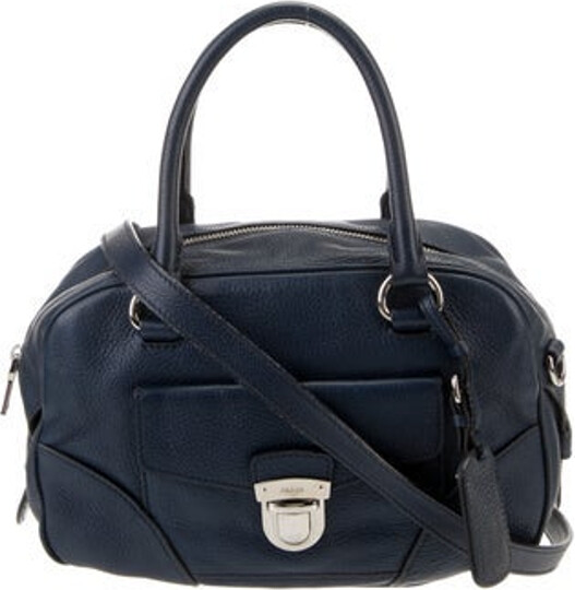 Prada Top Handle Bag Baltico Vitello Daino Leather Silver-Tone Hardware Rolled Handles & Single Adjustable Shoulder Strap Logo Jacquard Lining Clasp Closure at Front Includes Authenticity Card Unfortunately, due to restrictions, this item may not be eligible for shipping in all areas.