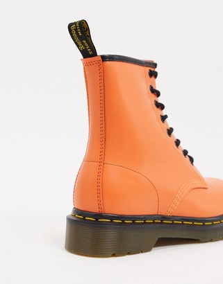 Dr. Martens 1460 leather flat ankle boots in orange