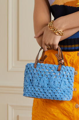 Embellished leather-trimmed crocheted raffia tote