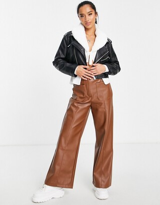 Stradivarius + STR Petite faux leather trousers in green