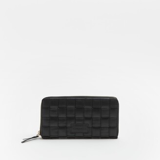black leather handbolsas river island