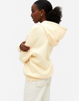 Thumbnail for your product : Monki Oda cotton hoodie in yellow - YELLOW