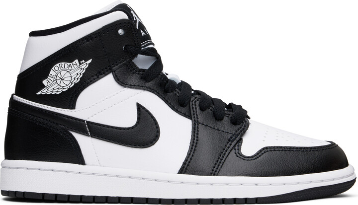 white and black high top nikes