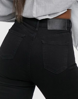 Reclaimed Vintage Inspired super skinny high waisted jeans in black