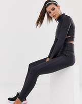Thumbnail for your product : Nike Training cropped long sleeve t-shirt with side cut outs in black