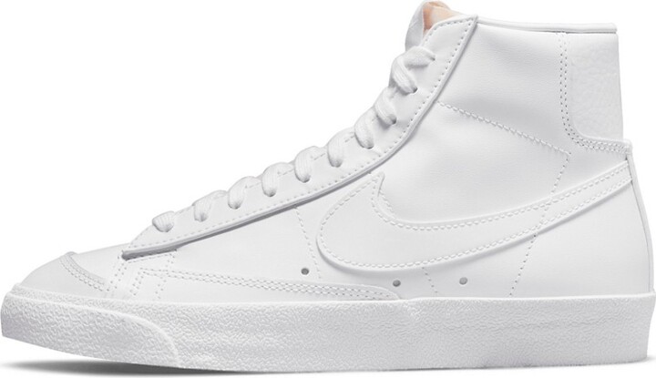 triple white blazers