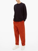 Thumbnail for your product : Raey Exaggerated Tapered-leg Corduroy Trousers - Dark Orange