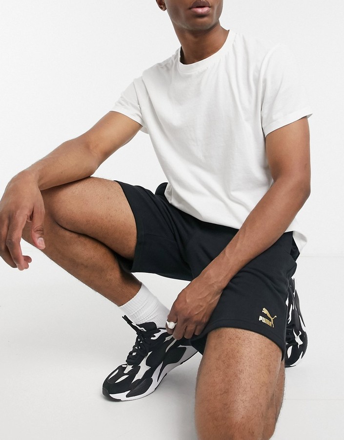 Puma TFS Unity metallic logo shorts in black - ShopStyle