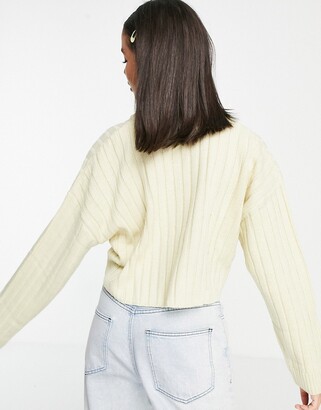 Kickers relaxed v neck jumper with contrast stripe and embroidered logo in wide rib knit