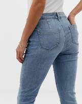 Thumbnail for your product : ASOS Petite DESIGN Petite super low rise flare jeans in mid wash blue