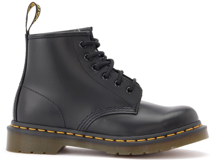 black boots with yellow stitching