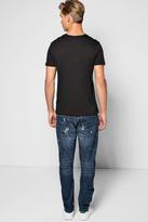 Thumbnail for your product : boohoo Relaxed Curved Rip And Repair Distressed Jeans
