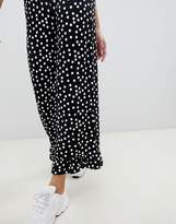 Thumbnail for your product : ASOS Tall DESIGN Tall trousers with fluted ruffle hem in spot print