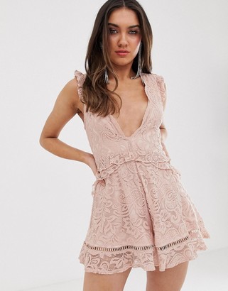 Love Triangle plunge front eyelash lace romper with flippy hem in soft mink