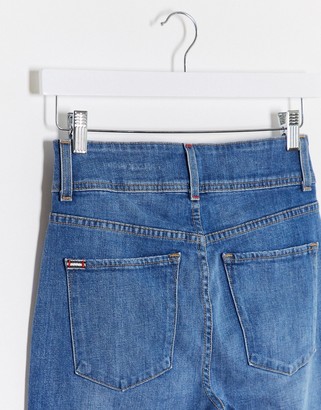 Alice + Olivia Jeans high rise skinny jeans with exposed buttons in blue