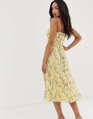 ASOS DESIGN midi dress with cami straps and cut out detail in floral print