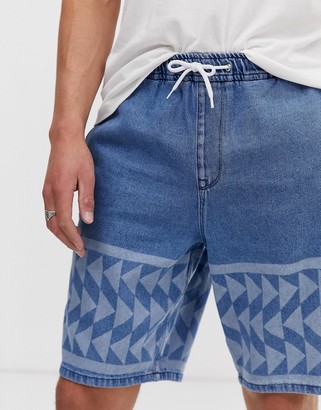 ASOS DESIGN relaxed fit denim shorts in mid wash blue with print