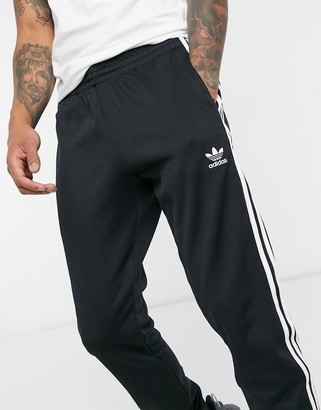 adidas adicolor three stripe skinny sweatpants in black - ShopStyle  Activewear Pants