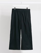 Thumbnail for your product : Monki Vilja organic cotton wide leg trousers in black