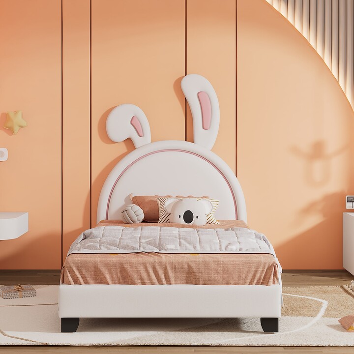 https://img.shopstyle-cdn.com/sim/9a/c9/9ac9553681a8c6bbf14a5751d9cfa73f_best/edwinray-twin-size-upholstered-leather-platform-bed-with-rabbit-ornament-white.jpg