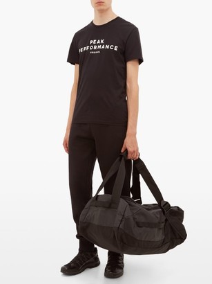 Peak Performance Vertical Logo-print Shell Duffle Bag - Black