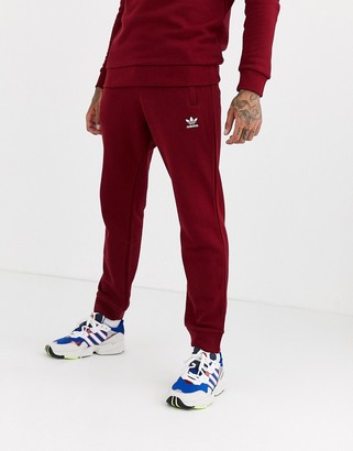 red adidas trousers