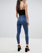 Thumbnail for your product : ASOS Petite DESIGN Petite Rivington high waist denim jeggings in mid blue wash with star bum detail