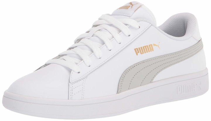 white and gold puma shoes