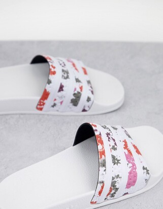 adidas Adilette sliders in white with acid floral print - ShopStyle Sandals