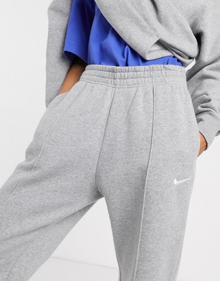 Nike mini Swoosh oversized joggers in grey - ShopStyle Activewear Pants