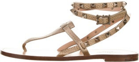 Valentino Leather Gladiator Sandals Gold & Metallic Rockstud Accents Studded Accents Wrap-Around Straps & Buckle Closure at Ankles Unfortunately, due to restrictions, this item may not be eligible for shipping in all areas.