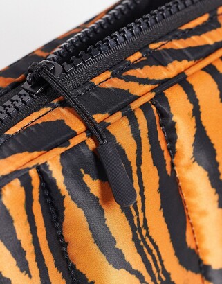 ASOS DESIGN padded nylon crossbody bag in tiger print - ShopStyle