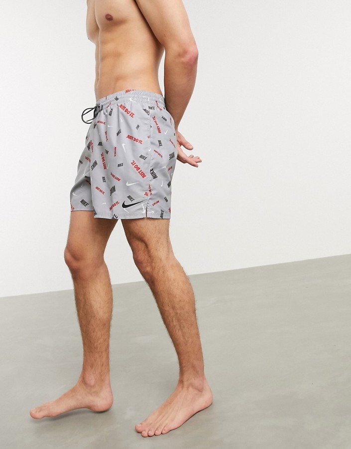 nike swimming 5inch volley shorts with all over swoosh print in black