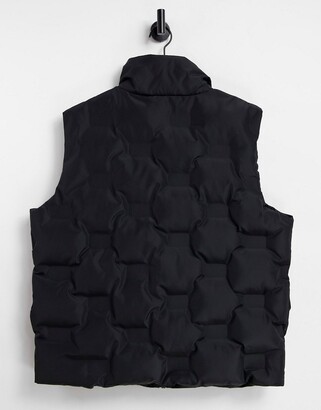 Reclaimed Vintage inspired unisex sleeveless puffer gilet in black -  ShopStyle