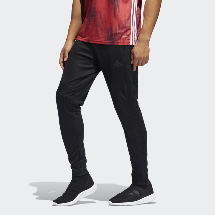 black adidas pants with red stripes