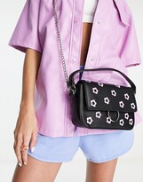 Thumbnail for your product : Skinnydip crossbody bag in black with pastel daisy embellishment