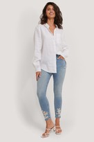 Thumbnail for your product : NA-KD Organic Cotton Ripped Hem Skinny Jeans