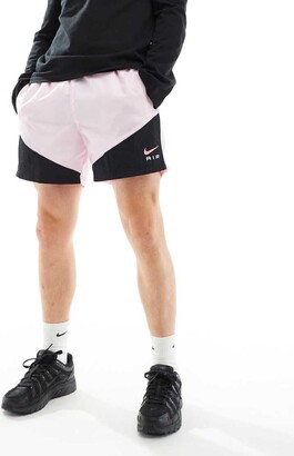 white and pink nike shorts