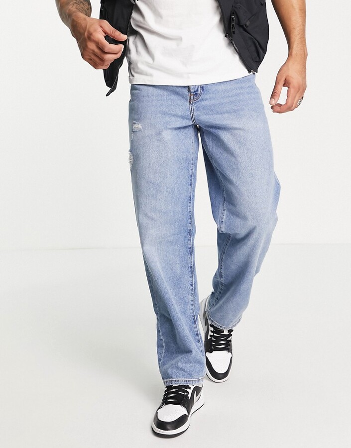 ASOS DESIGN baggy jeans in light wash blue with abrasions - ShopStyle