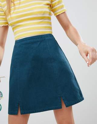 ASOS DESIGN denim split front mini skirt in emerald green