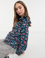 Thumbnail for your product : New Look high neck shoulder frill blouse in blue floral