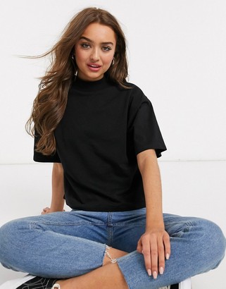 ASOS DESIGN Petite boxy crop t-shirt with high neck in black