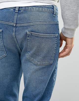 ASOS Tapered Jeans In Vintage Mid Wash Blue