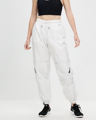 Nike Women's White Pants - Repel Swoosh Woven High-Rise Joggers - ShopStyle  Trousers