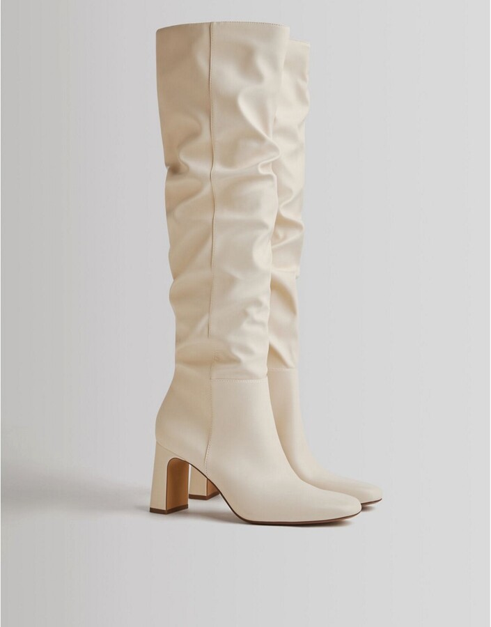 Bershka slouchy high leg boots in ecru - ShopStyle