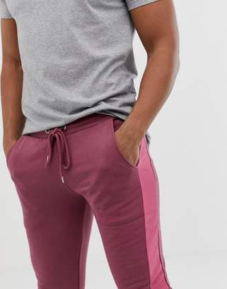 ASOS Design DESIGN skinny joggers with side stripe in purple