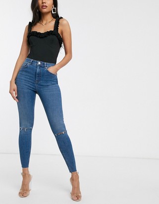 ASOS DESIGN DESIGN high-rise ridley 'skinny' jeans in mid blue with rips