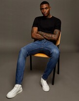 Thumbnail for your product : Topman cotton blend stretch slim jeans in mid wash