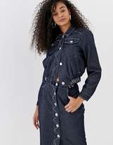 Thumbnail for your product : Emporio Armani cropped denim jacket with logo waist band
