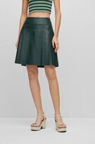 Slim-fit pleated skirt in waxed leath 